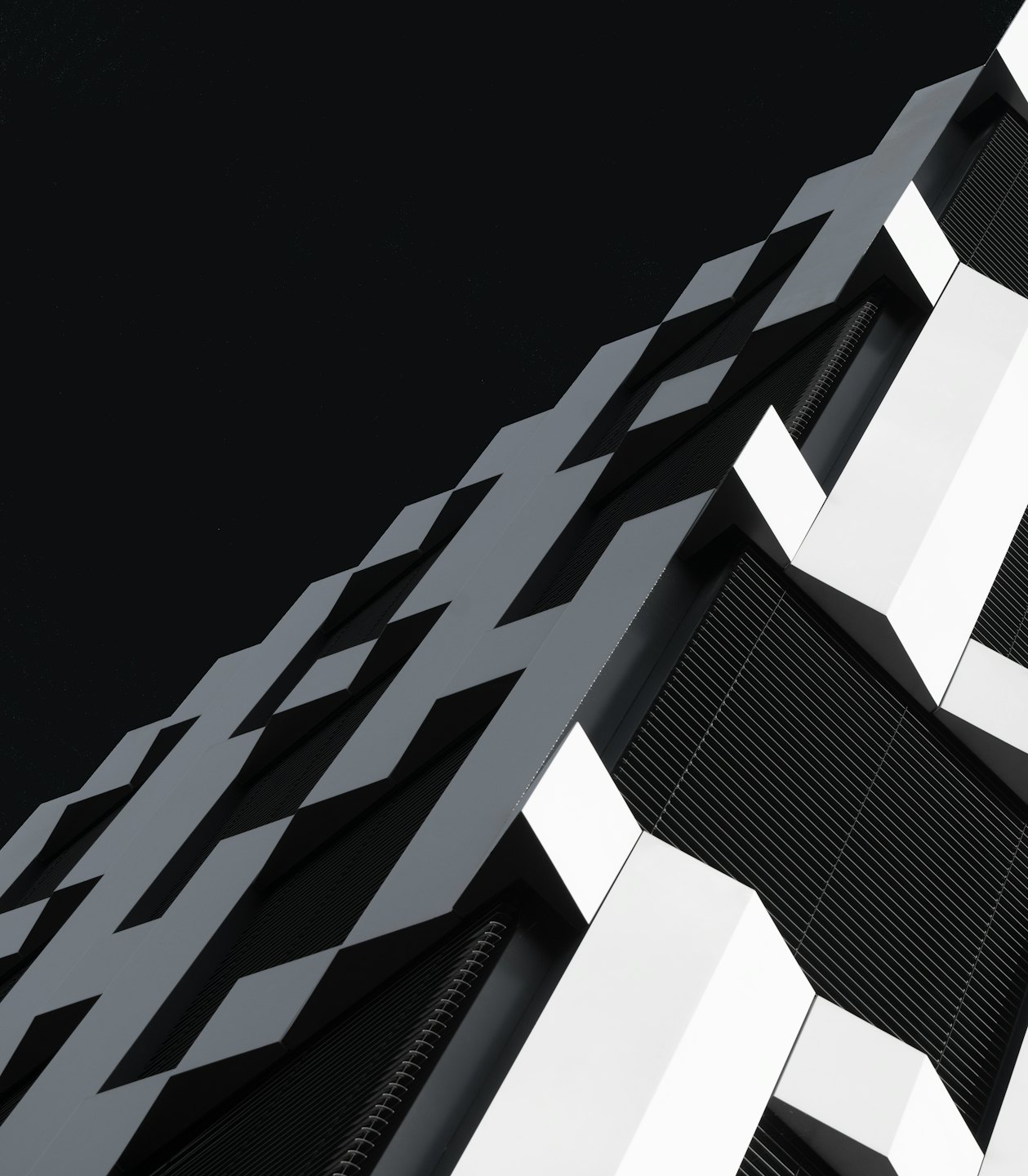 Modern building facade with abstract geometric pattern.